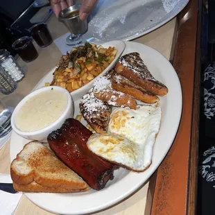 Full breakfast with French toast, eggs, potatoes, grits and hot polish sausage. Well done!
