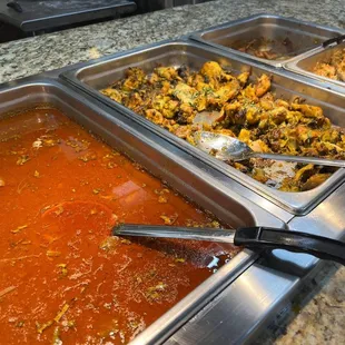 a variety of food items in a buffet
