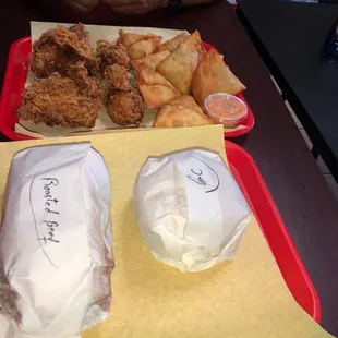 two trays of food on a table