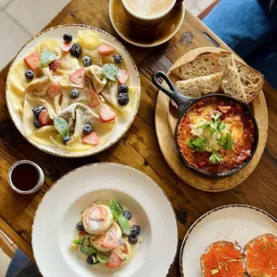 Mlyntsi With berries, Honey Lavender Latte, SHAKSHUKA, Syrnyky With Custard, Caviar Bagel