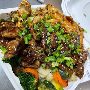 a close up of a meal in a styrofoam container