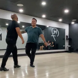 Salsa lesson - two instructors providing the final demonstration