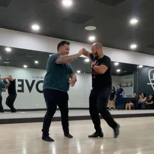 Salsa lesson - two instructors providing the final demonstration to much applause for their styling!