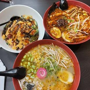 three bowls of food on a table