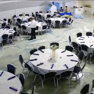 What size tables do we have? 72" What do your chairs look like? We provide sturdy, metal frame banquet chairs.