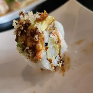 a piece of sushi on a plate