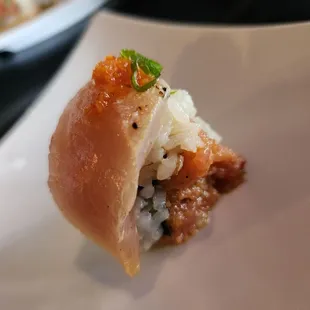 a piece of sushi on a plate