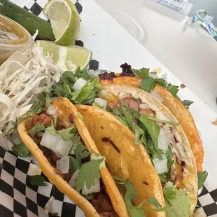 two tacos on a checkered plate