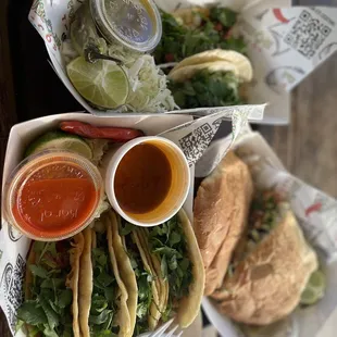 Birria tacos, tacos al pastor, and torta al pastor