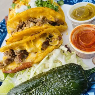 4 hard shell carne asada tacos. 2 plain and 2 loaded. Definitely great food.