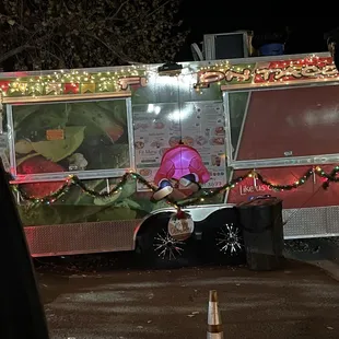 a food truck decorated for christmas
