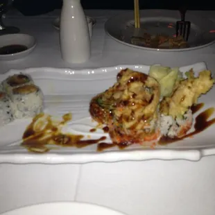 Spicy tuna and spider roll. We forgot to take a pic before eating ( warm Saki in the back)
