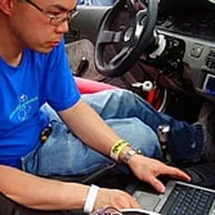 Ray tuning a car.