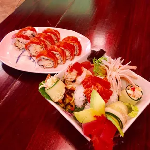 two plates of sushi on a table