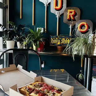 a pizza in a box on a table