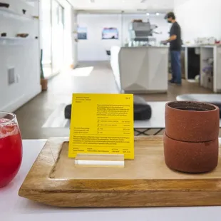 a drink and a menu on a table