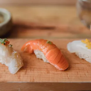 a variety of sushi on a cutting board