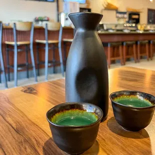 two bowls and a pitcher on a table
