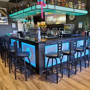 a bar with a lot of stools