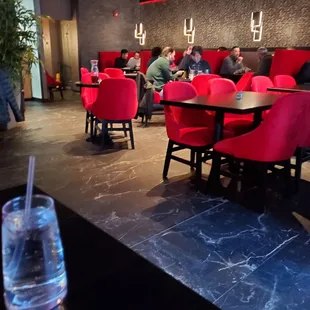 people sitting at tables in a restaurant