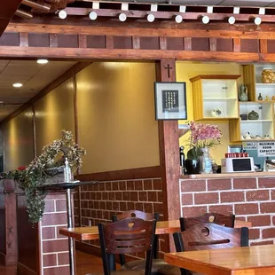 a dining area with tables and chairs