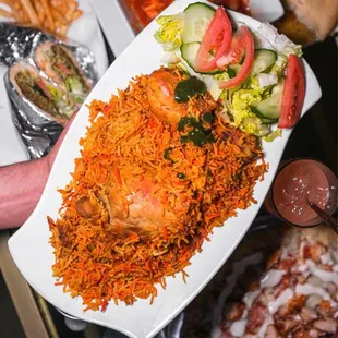 Chicken biryani - butter chicken on the top of the photo