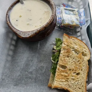 a bowl of soup and a sandwich