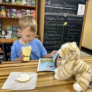 A dreamsicle drink with a sugar cookie and his new stuffy and Pete the cat book ! 3