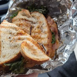 a sandwich wrapped in foil