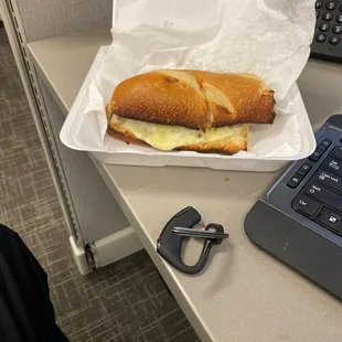 a sandwich in a styrofoam container