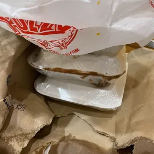 This is the sort of packaging for a to go order. Bag is wet and fell apart