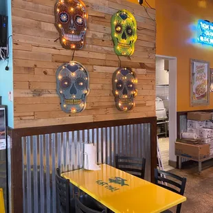 a yellow table and chairs