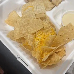 Kids nachos AKA chips with sprinkled cheese (not melted)