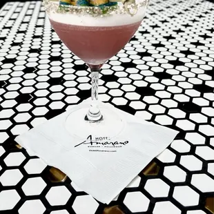 a cocktail with fruit on top
