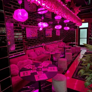 a bar with pink lighting