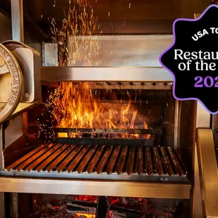 a grill with flames in the background