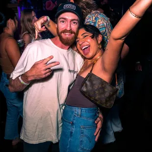 a man and a woman posing for a picture