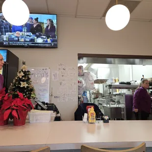 Diner counter looking into the huge kitchen.
