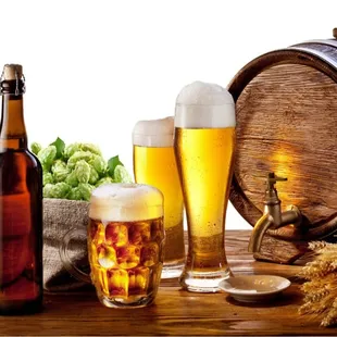 a glass of beer and a barrel of beer
