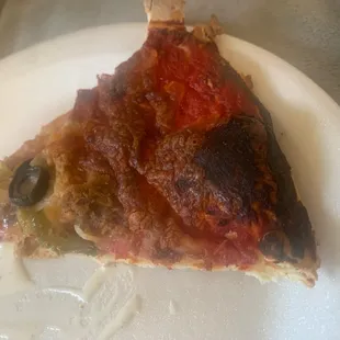 Burned pizza with barely any toppings