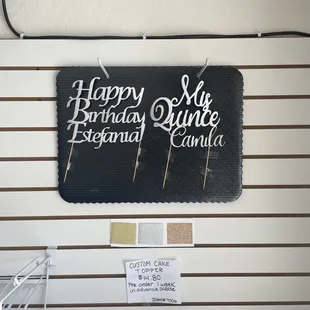 We offer custom cake signs. They must be ordered at least a week in advance.