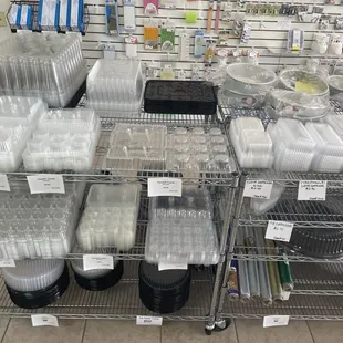 Domes, regular and mini cupcake clamshells, and pie containers. We also sell candy bags and foils.
