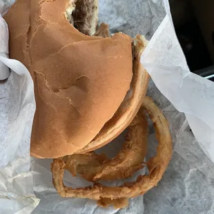 a hamburger and onion rings