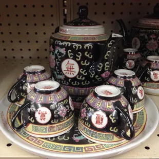 a variety of oriental teapots