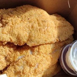 a box of fried chicken and french fries