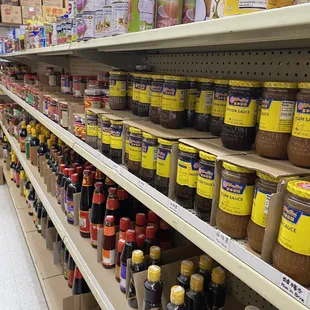 a shelf full of condiments