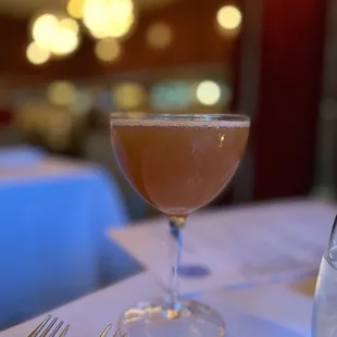 a glass of wine on a table