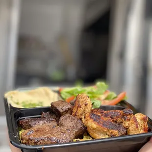 Combo beef tenderloin and chicken kabob w/ hummus, salad, rice