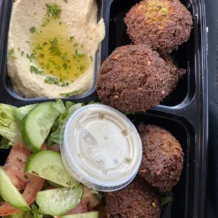 Home made vegetarian Falafel, hummus, salad, tahini sauce!