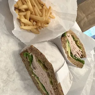 Turkey avocado sandwich and fries